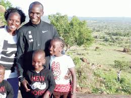 Eliud Kipchoge, his wife and children
